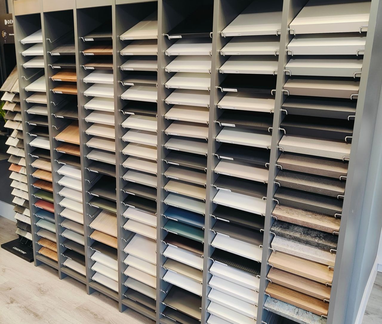 Rows of worktop and finish samples in a materials display.