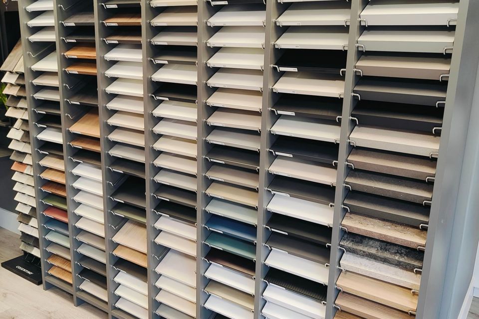 Rows of worktop and finish samples in a materials display.